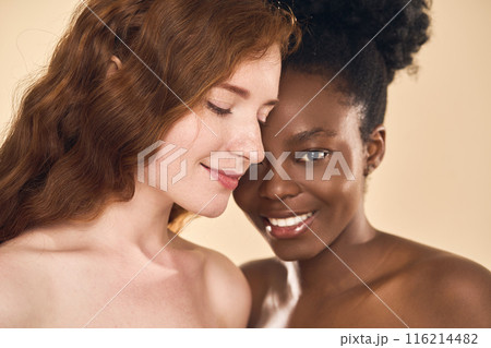 Two Women Embracing Diversity and Friendship with Joyful Smiles 116214482