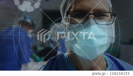 Image of round scanner against caucasian senior male surgeon at hospital 116216155