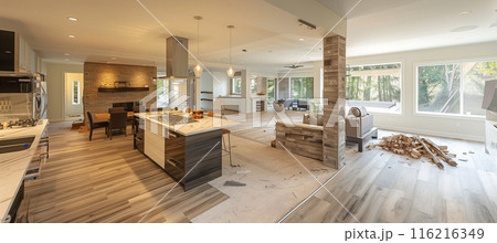 Demolishing a wall to create an open floor plan in home renovation Demolishing a wall to create an open floor plan in home renovation 116216349