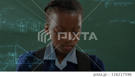 Image of african american school girl standing with chalkboard on background 116217596