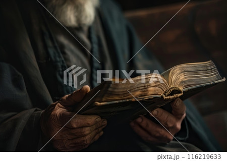 Senior priest holding holy bible reading scripture 116219633