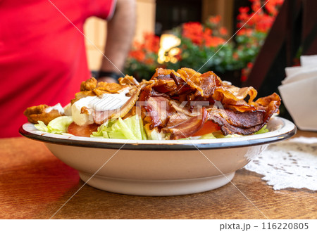 Polish Caesar salad with chicken, bacon and vegetables, high-calorie meat salad with fresh vegetables 116220805