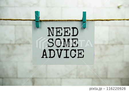 Need some Advice text on paper card hanging on the wall with Clothespins 116220926