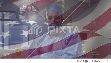 Image of american flag over caucasian male doctor smiling 116221007