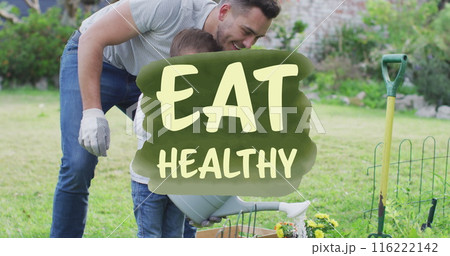 Image of caucasian man and young boy gardening together, both smiling and enjoying activity 116222142