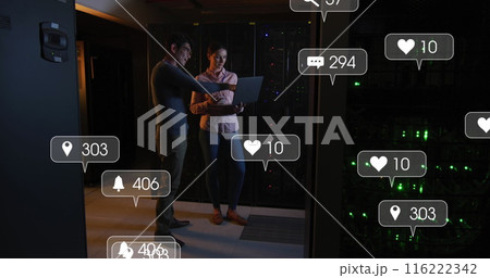 Image of social media icons over diverse male and female engineer using laptop at server room Image of social media icons over diverse male and female engineer using laptop at server room 116222342