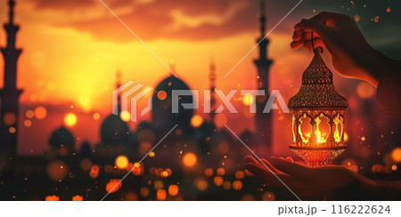 Muslim man holding Arabic lanterns Islamic with Mosque Silhouette dome. Ramadan Kareem, iftar festival or Eid Mubarak banner background. 116222624