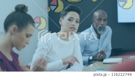 Image of pie graph icons against caucasian woman discussing with her colleagues at office 116222749