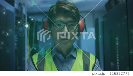 Image of molecular structures floating over asian male engineer standing at server room Image of molecular structures floating over asian male engineer standing at server room 116222775