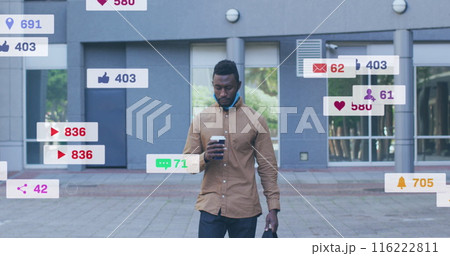Image of social media icons and numbers over african american man walking with coffee 116222811