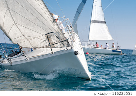 Close-up of sailing yachts racing in the mediterranean sea 116223553