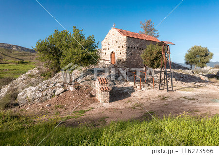 Old stone Agios Nikolaos church standing on a rock on a clear sunny day. Paphos District, Cyprus 116223566