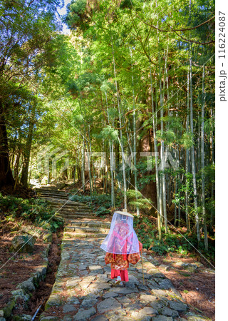 Japanese woman wearing traditional Heian Period costume at the Kumano Kodo Pilgrimage Route in Wakayama prefecture of Japan Japanese woman wearing traditional Heian Period costume at the Kumano Kodo Pilgrimage Route in Wakayama prefecture of Japan 116224087