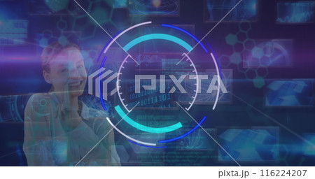 Young Caucasian woman smiling while interacting with futuristic digital interface Young Caucasian woman smiling while interacting with futuristic digital interface 116224207
