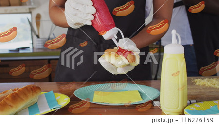 Image of hot-dog icons over african american woman working in food truck Image of hot-dog icons over african american woman working in food truck 116226159