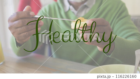 Image of healthy text over african american man eating breakfast Image of healthy text over african american man eating breakfast 116226160