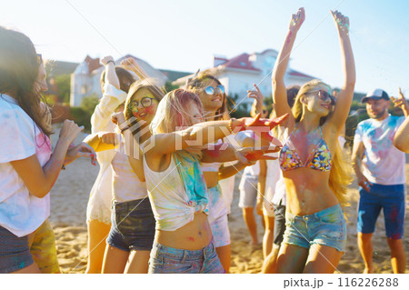 Teenagers Friends have fun at the holi festival. Beach Party. Celebrating traditional indian spring holiday. Teenagers Friends have fun at the holi festival. Beach Party. Celebrating traditional indian spring holiday. 116226288