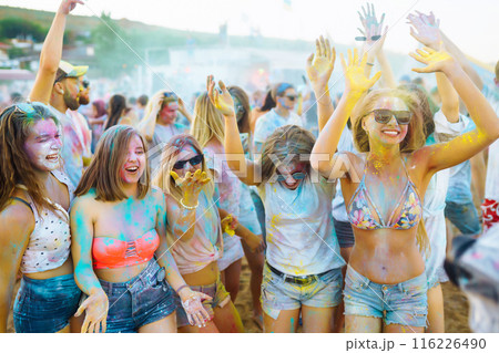 Teenagers Friends have fun at the holi festival. Beach Party. Celebrating traditional indian spring holiday. Teenagers Friends have fun at the holi festival. Beach Party. Celebrating traditional indian spring holiday. 116226490