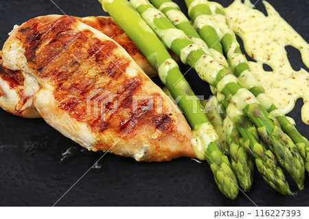 Chicken fillet and asparagus. Chicken fillet and asparagus. 116227393