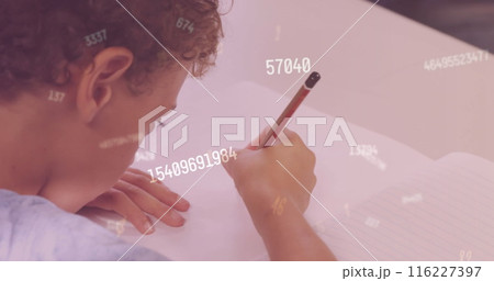 Image of numbers over biracial schoolboy writing 116227397