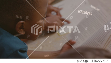Image of changing numbers and letters, overhead view of african american students reading book Image of changing numbers and letters, overhead view of african american students reading book 116227402