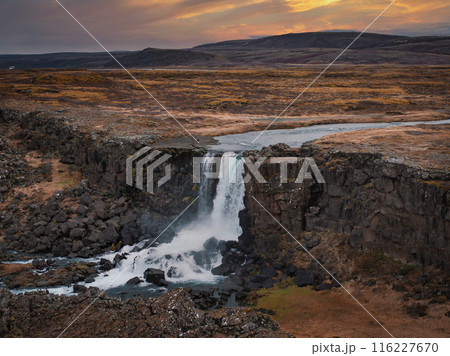 Aerial panorama of the Oxarafoss waterfalls in Iceland. Oxarafoss also called Oxararfoss is located in the Thingvellir National Park on the Oxara River. The tectonic plates of America and Eurasia. Aerial panorama of the Oxarafoss waterfalls in Iceland. Oxarafoss also called Oxararfoss is located in the Thingvellir National Park on the Oxara River. The tectonic plates of America and Eurasia. 116227670