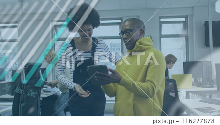 Image of graphs, globe and computer language over diverse coworkers discussing over tablet 116227878