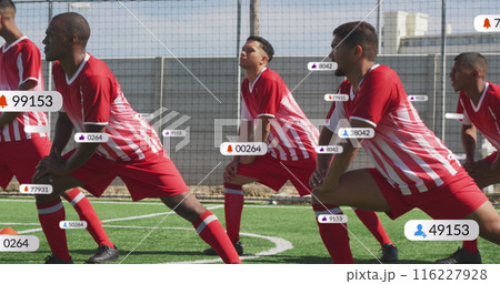 Image of multiple graphs over diverse soccer player doing stretching against nets on ground 116227928