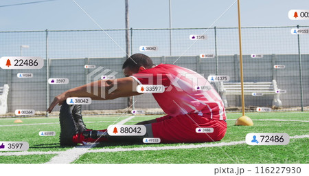 Image of multiple notification bars over biracial soccer player doing stretching on ground Image of multiple notification bars over biracial soccer player doing stretching on ground 116227930