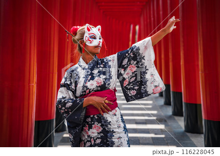 Asian girl in kimono and umbrella in Japanese theme park Hinoki Land in Chai Prakan District, Chiang 116228045