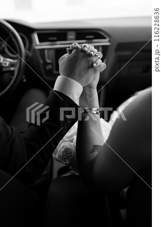 Wedding. Hands of the newlyweds. The hands of a couple in love. 116228636