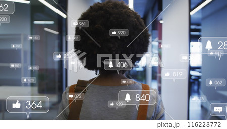 Image of media icons over african american businesswoman in office Image of media icons over african american businesswoman in office 116228772