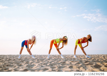 Three young woman in bright swimsuits dancing. Sport, summer, fitness, urban culture concept. 116230298