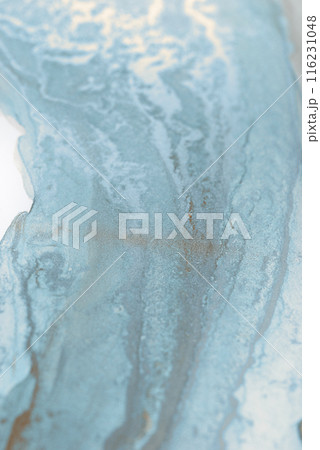 A close-up abstract image showcasing swirling patterns in shades of blue and white. The textures resemble water or ink, creating a dreamy, ethereal effect 116231048