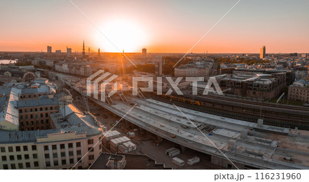 Huge Rail Baltic construction sight project in progress in Riga, Latvia. Building a main central train station in the center of Riga. Aerial view. 116231960