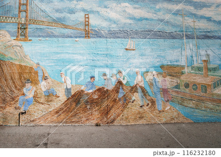 Colorful mural illustrating maritime scene with figures in blue and white clothing near Golden Gate Bridge in San Francisco. Bay, sailboats, clear sky. Colorful mural illustrating maritime scene with figures in blue and white clothing near Golden Gate Bridge in San Francisco. Bay, sailboats, clear sky. 116232180