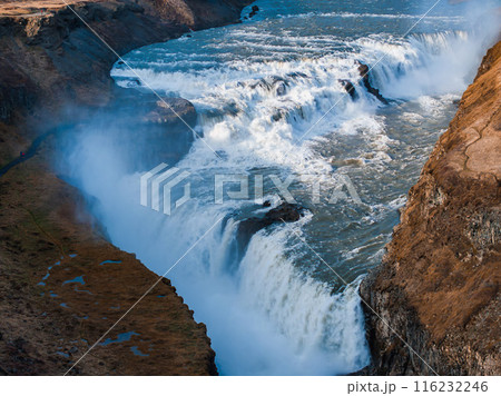 Panoramic summer view of popular tourist destination - Gullfoss waterfall in Iceland. Dramatic aerial view on Hvita river. Incredible morning scene of Iceland, Europe.  116232246
