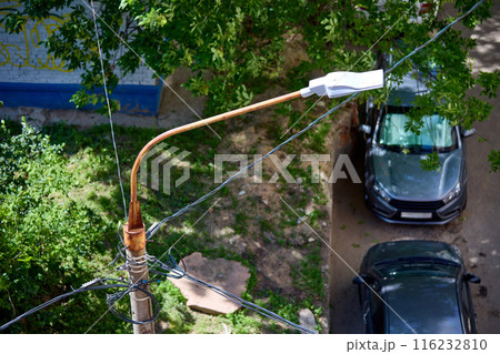 Electric wire cable on street lamp post Electric wire cable on street lamp post 116232810