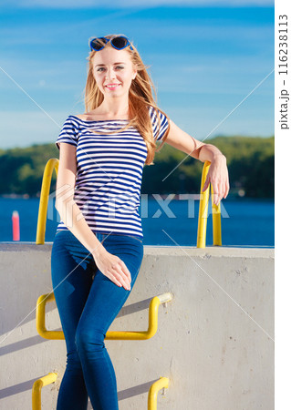 woman casual style against stone wall 116238113