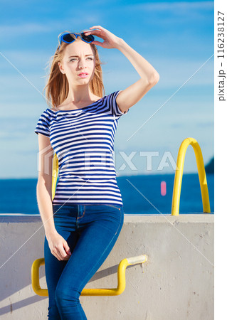 woman casual style against stone wall 116238127