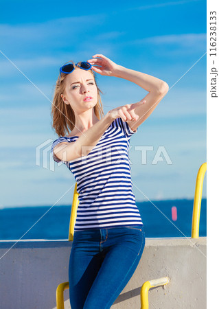 woman casual style against stone wall 116238133