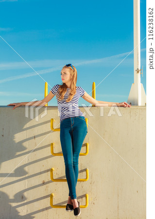 woman casual style against stone wall 116238162