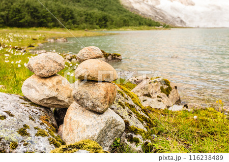 Stones stack on lake shore, Norway Stones stack on lake shore, Norway 116238489