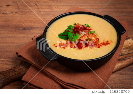 pumpkin cream soup with shrimp, herbs and spices, homemade, no people, 116238709