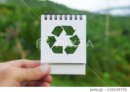 Recycle symbol on white notepad with nature beauty background. Reuse, reduce and recycle 116238730