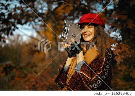 smiling stylish 40 years old woman in red hat smiling stylish 40 years old woman in red hat 116239469
