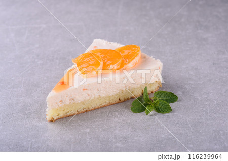 Orange cheesecake on a gray background for a coffee shop menu 116239964