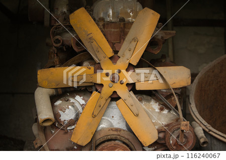 blades on a metal fan on an old rusty piece of mechanism 116240067