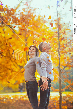 happy romantic boyfriend and girlfriend in park rejoicing 116240322