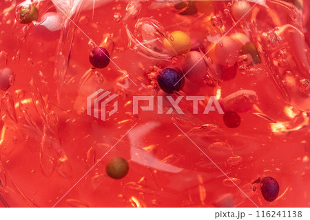 Colorful gel texture, clear skincare cream with bubbles and decorative figurines background, transparent beauty serum, colored cosmetic product close up Colorful gel texture, clear skincare cream with bubbles and decorative figurines background, transparent beauty serum, colored cosmetic product close up 116241138